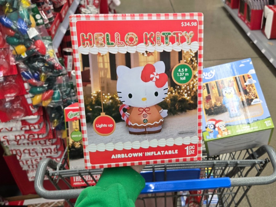 Hello Kitty in Gingerbread Dress Christmas Inflatable in front of shopping cart