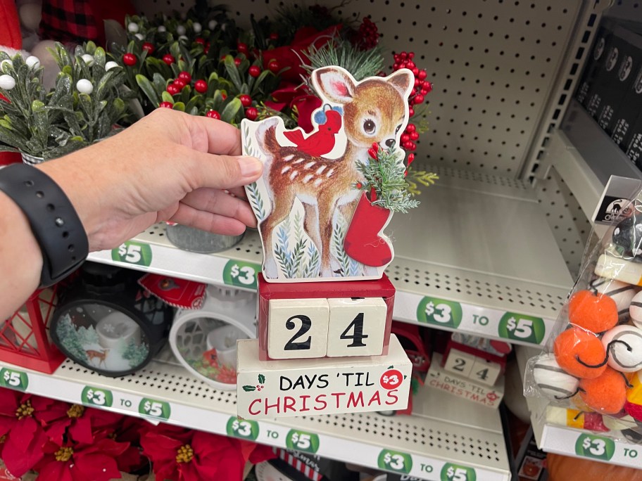 woman holding a Vintage Look Christmas Countdown Calendar