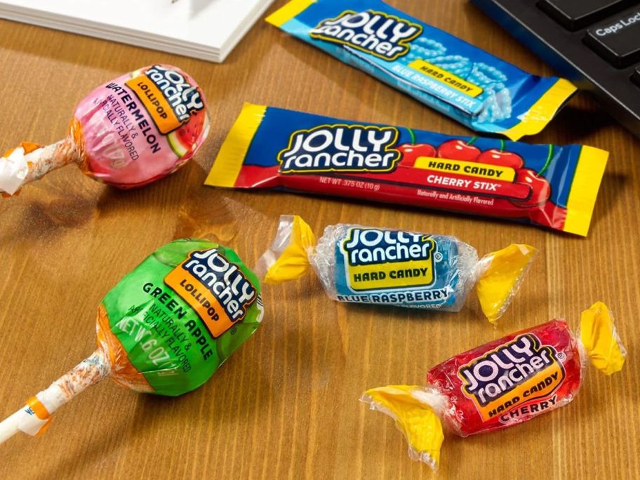 assorted jolly ranchers candies on a desk