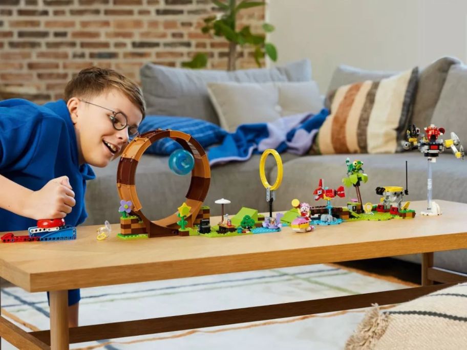 kid playing with LEGO Sonic the Hedgehog Sonic's Green Hill Zone Loop Challenge Playset