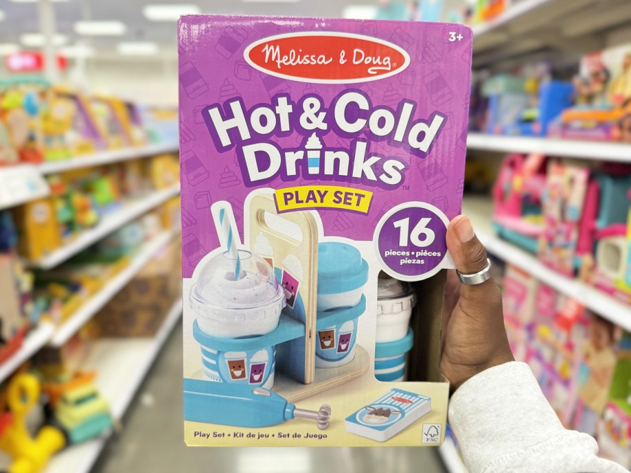 hand holding up box for Melissa & Doug Hot & Cold Drink Set in store