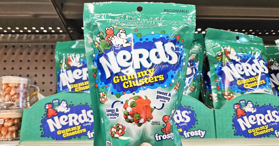 hand holding a green bag of Nerds Frosty Gummy Clusters in store