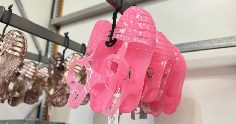 A rack of Pink Jelly Shoes at Old Navy
