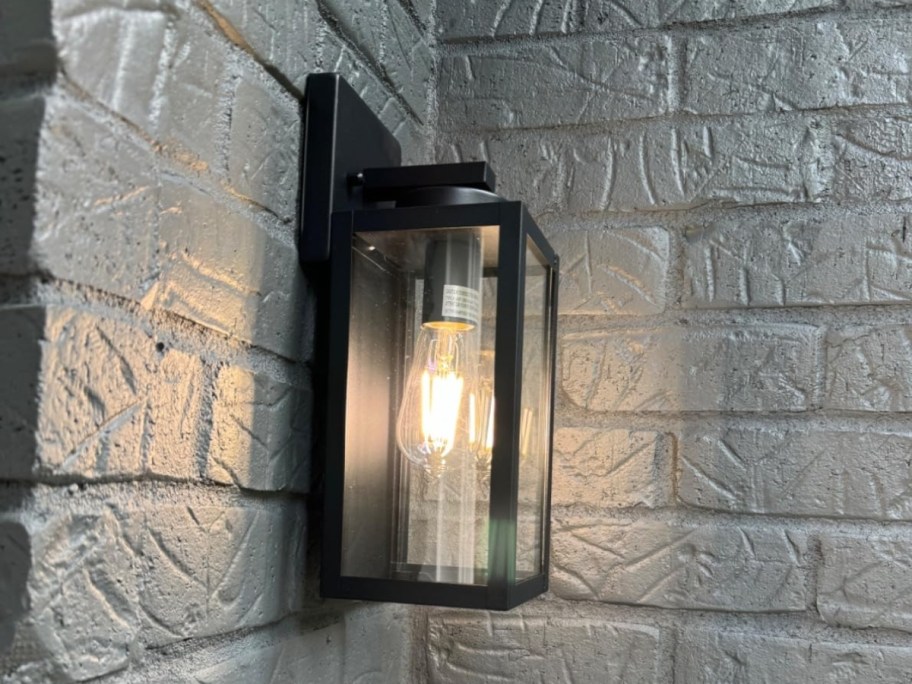outdoor lantern light fixture on exterior wall in matte black