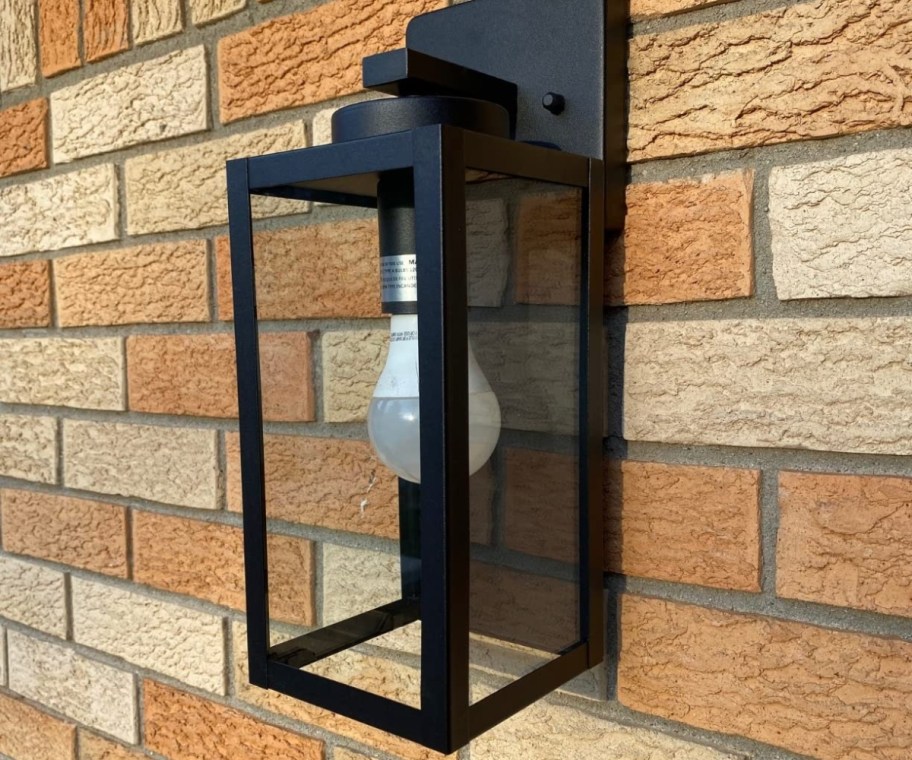 outdoor lantern light fixture on exterior wall in matte black