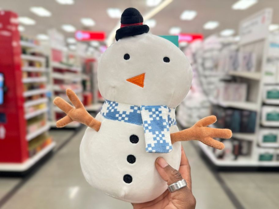 Pillowfort Mini Snowman Kids' Plush in hand in store