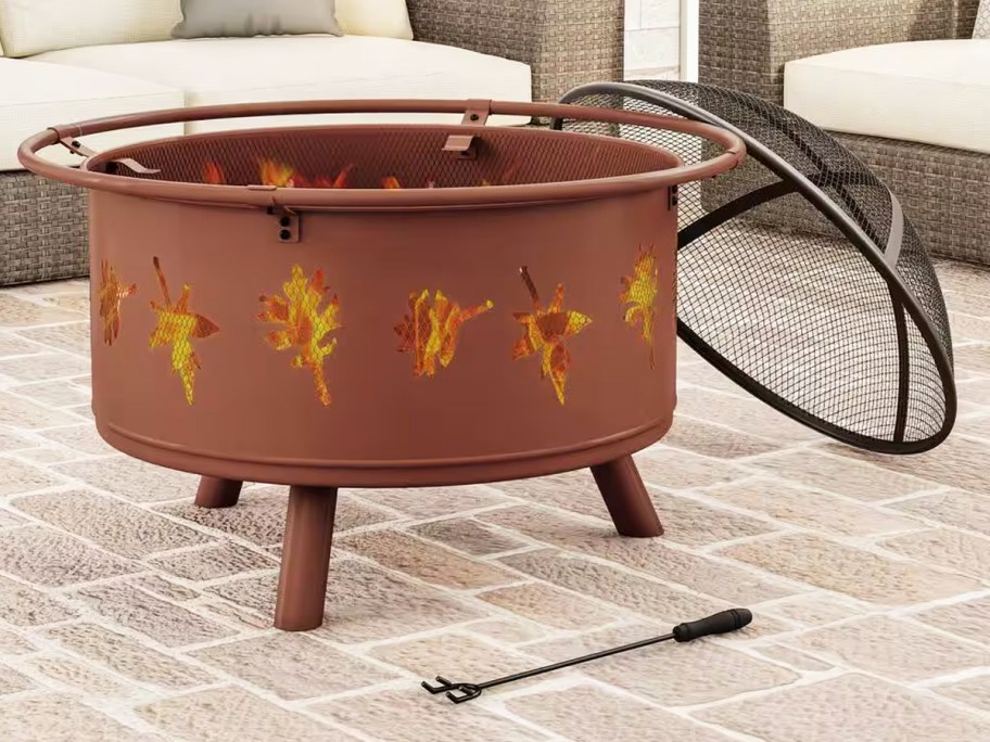 fire pit with leaf shaped cut-outs