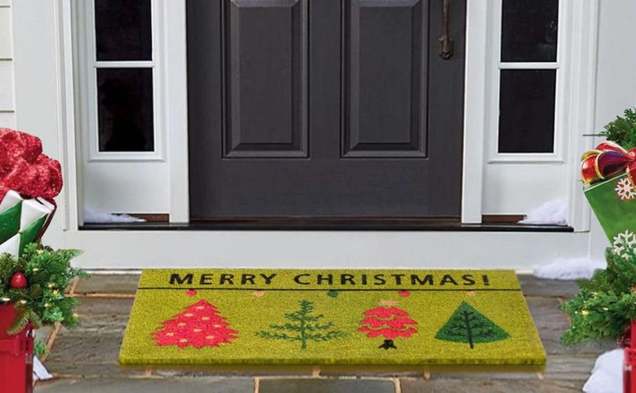 a merry Christmas doormat in front of a door
