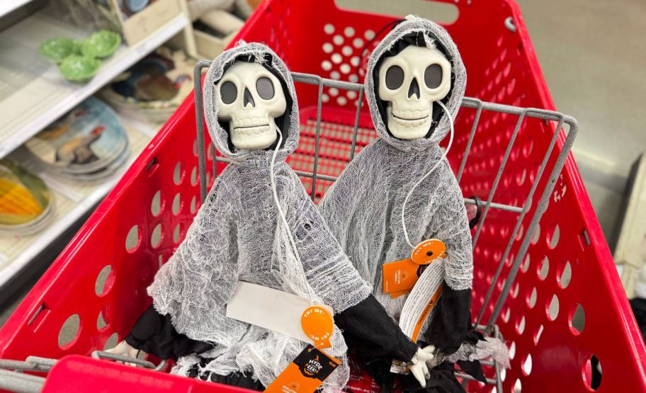 two skeleton ghouls in a target shopping cart