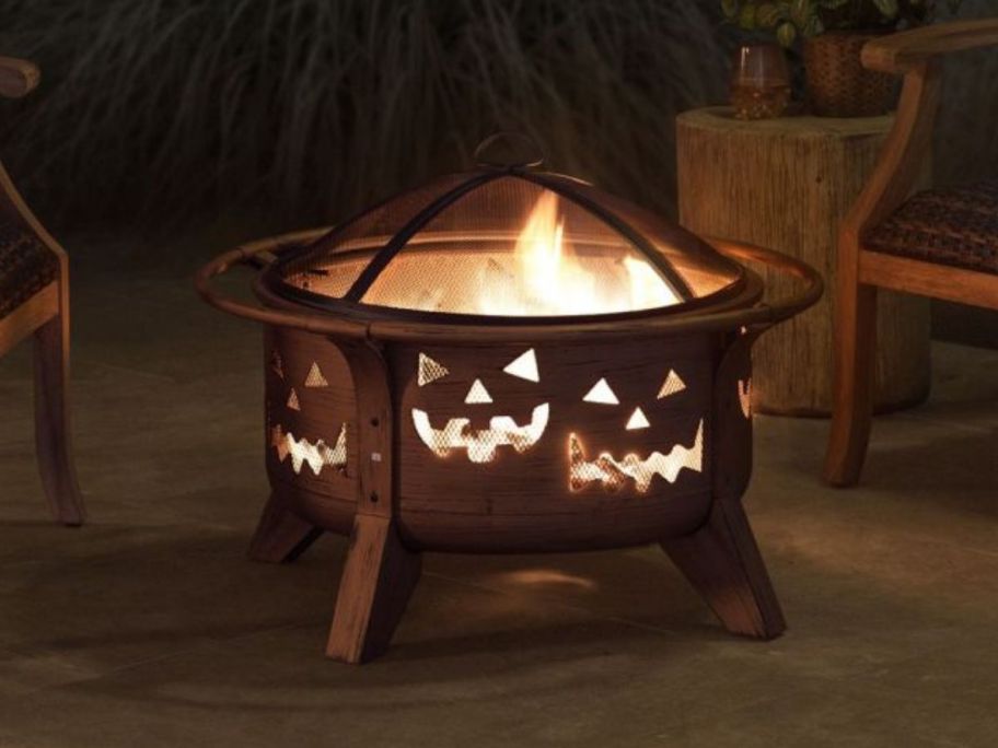 A fire pit with Jack-O-Lantern faces 