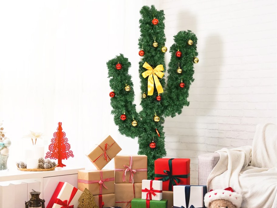 cactus christmas tree with wrapped presents below it
