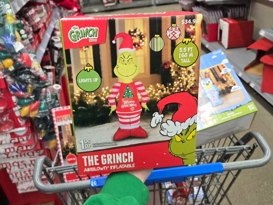 The Grinch in Pajamas Christmas Inflatable in front of shopping cart