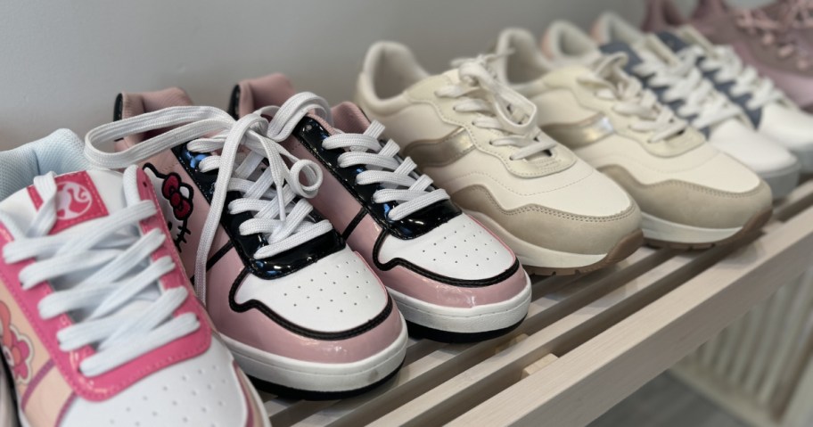 walmart women's sneakers lined up on shelf