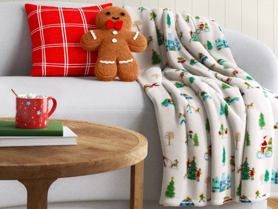 Wondershop Holiday Printed Plush Throw Blanket - Scene Ivory on couch