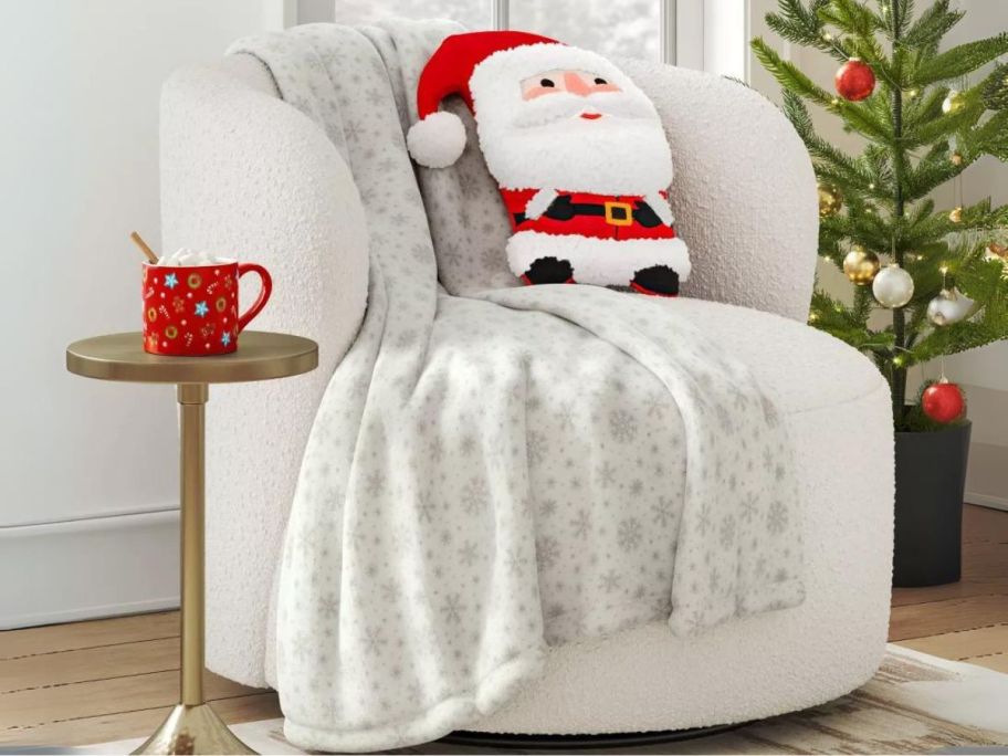 Wondershop Holiday Printed Plush Throw Blanket - Snowflake Ivory on chair
