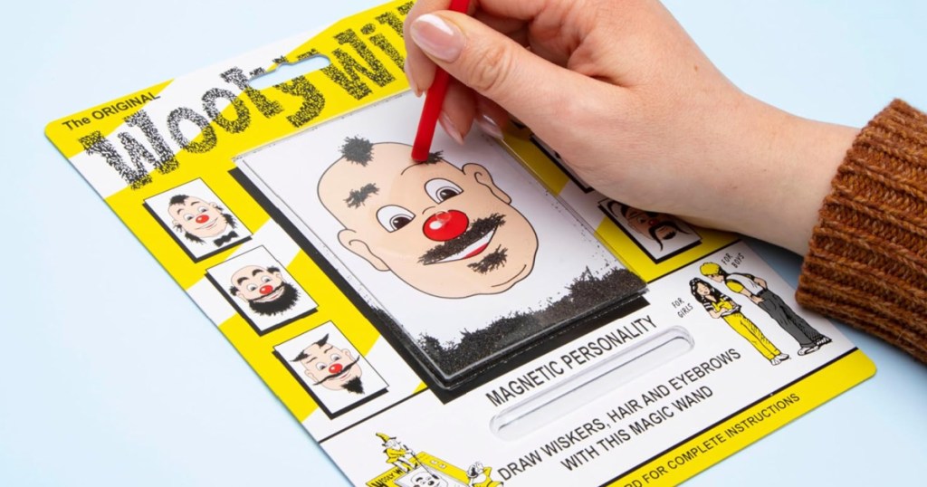 person playing with Wooly Willy Magnetic Toy