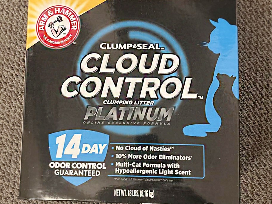 cloud control arm and hammer litter box laying on carpet 