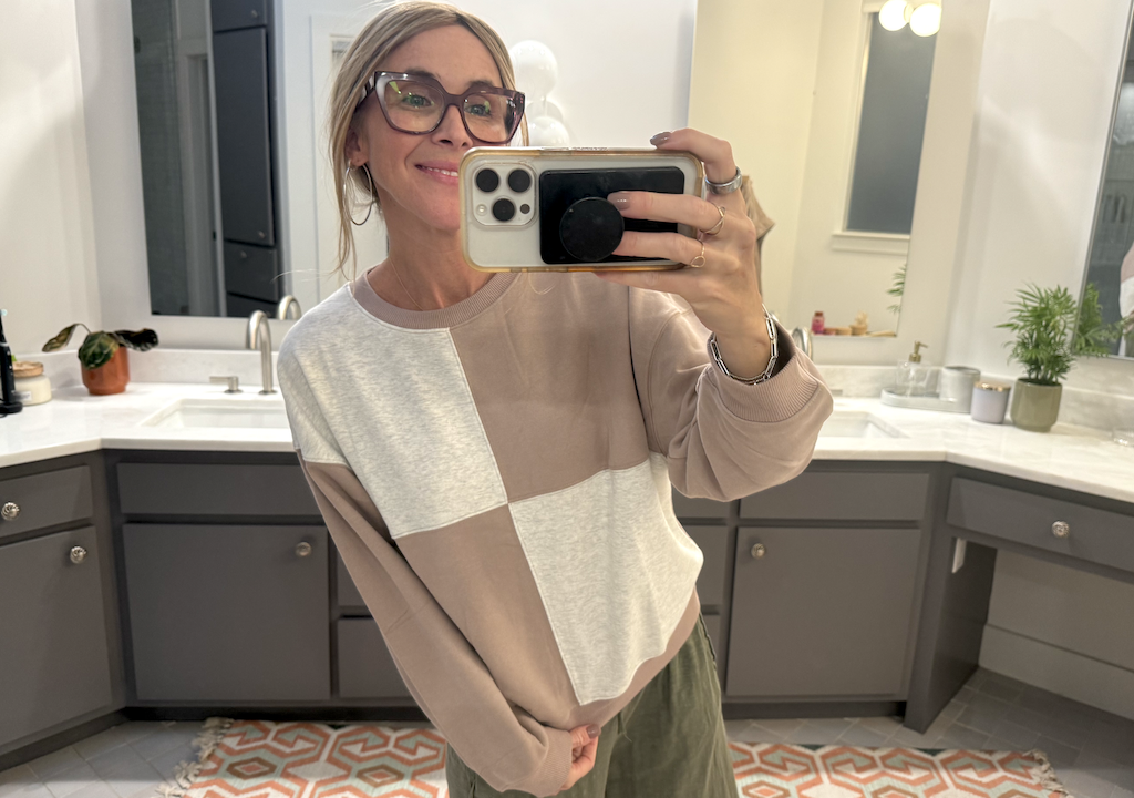 woman wearing color block pullover 