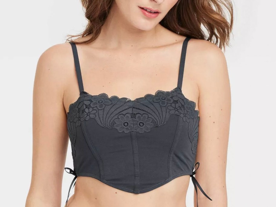 girl wearing gray bralette 