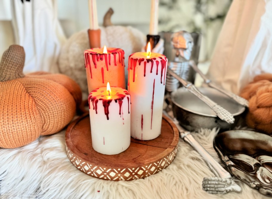 crayon bloody candles on a stand