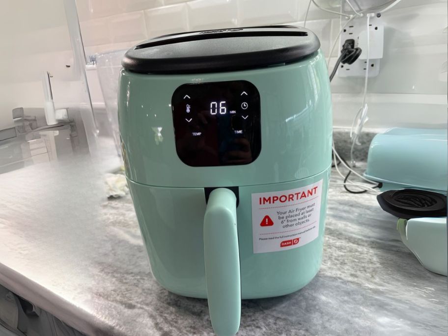 Dash Tasti-Crisp Electric 2.6-Quart Air Fryer Oven in Aqua on counter