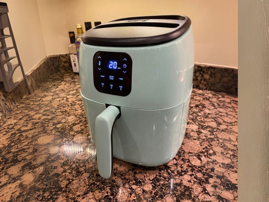 Dash Tasti-Crisp Electric 2.6-Quart Air Fryer Oven in Aqua on counter
