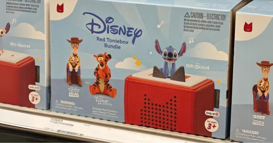 blue boxes of Disney Toniebox audio players with Disney figures Stitch, Tigger, and Woody on a Target shelf