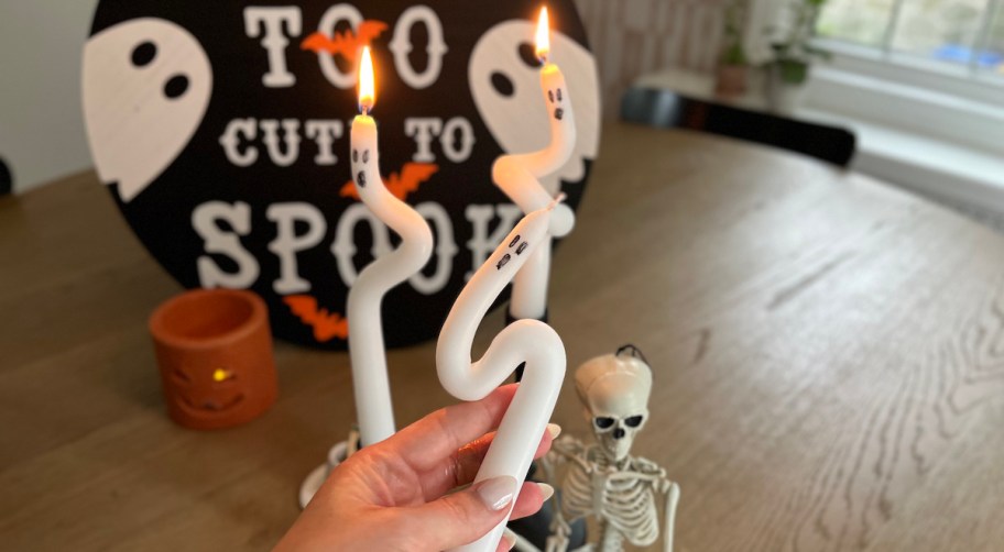 hand holding DIY ghost candles