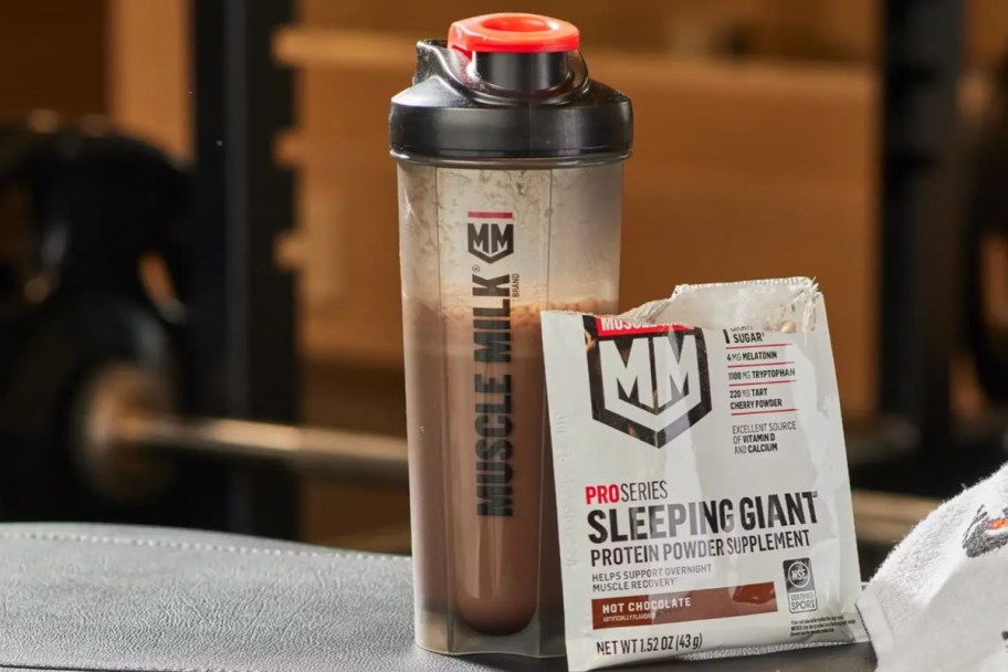 shaker bottle next to protein powder