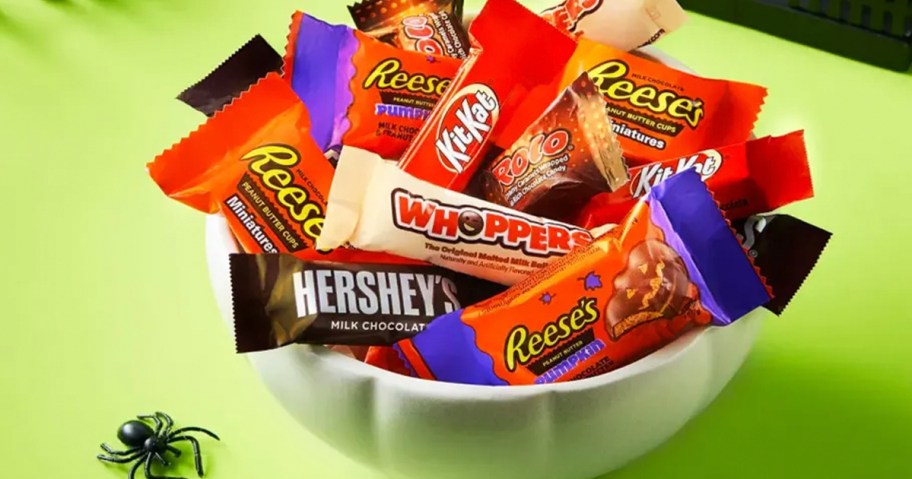 hershey, reeses, whoppers, kit kat and more candy in bowl on table