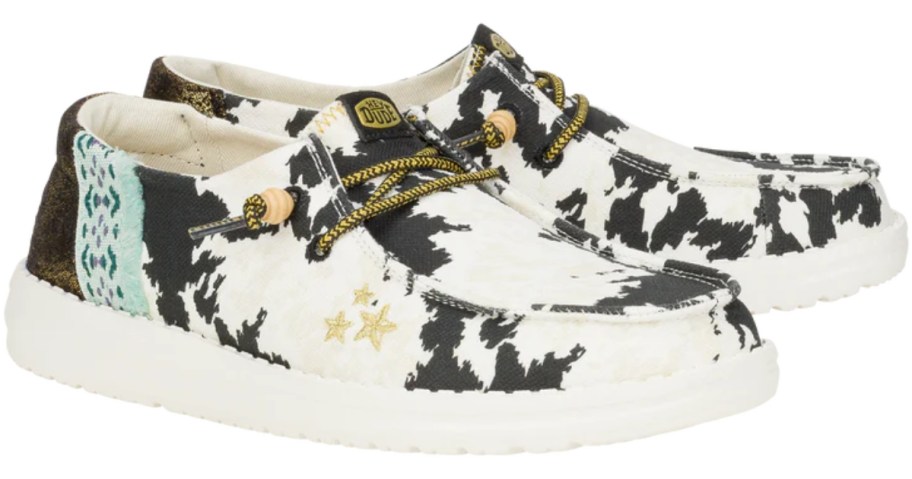 women's cow print HEYDUDE slip in shoes