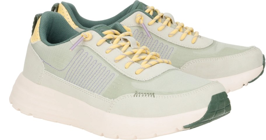 women's HEYDUDE athletic style sneakers in white with green and yellow accents