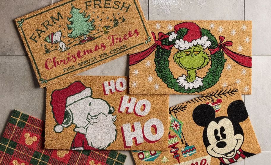 a collection of doormats with various designs including mickey mouse, snoopy and the grinch