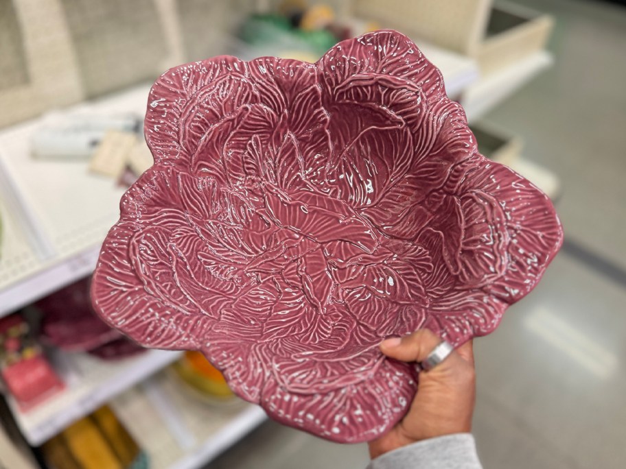 hand holding cabbage stoneware bowl 