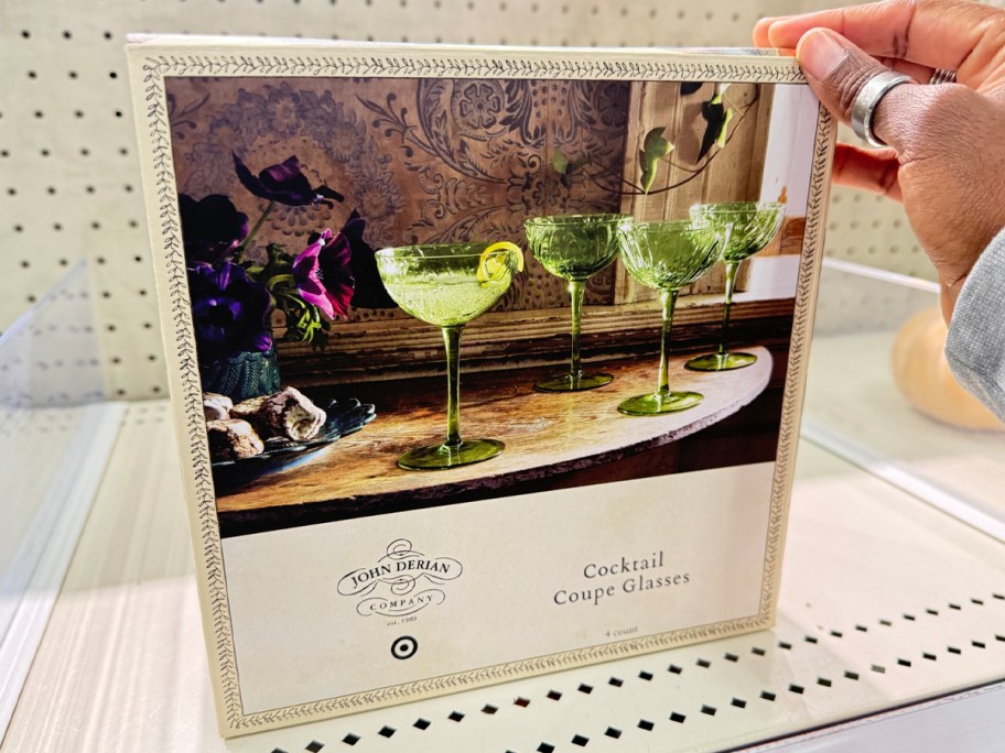 hand reaching for cocktail glasses box