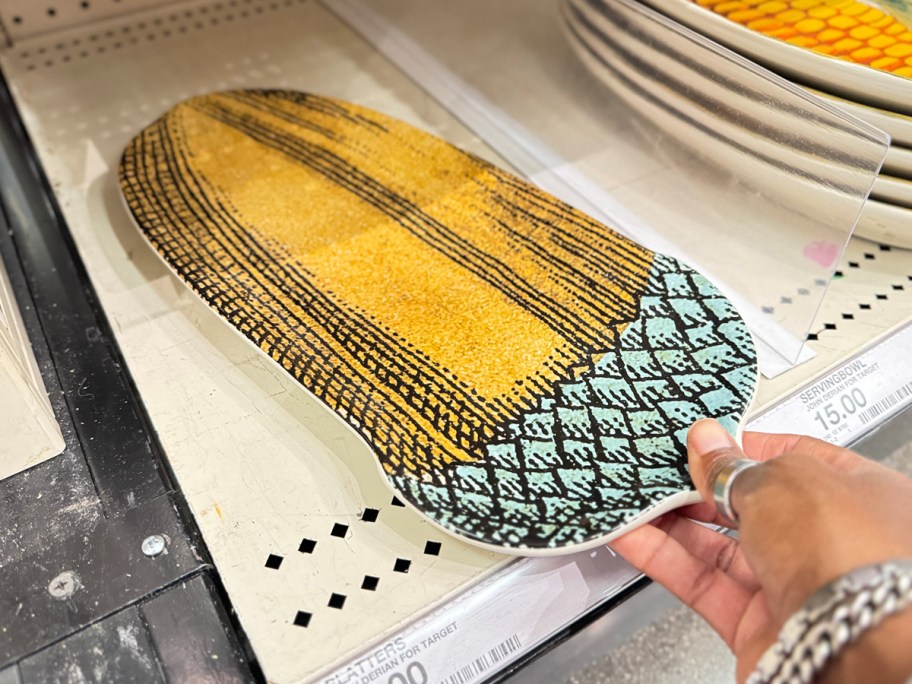 hand reaching for acorn stone platter