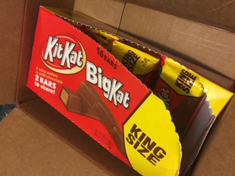an open box of kit kat king size candy bars in delivery box