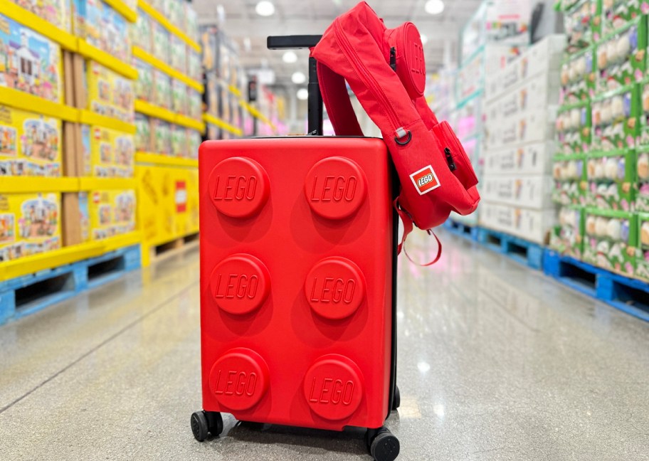 red lego luggage and backpack sitting in store