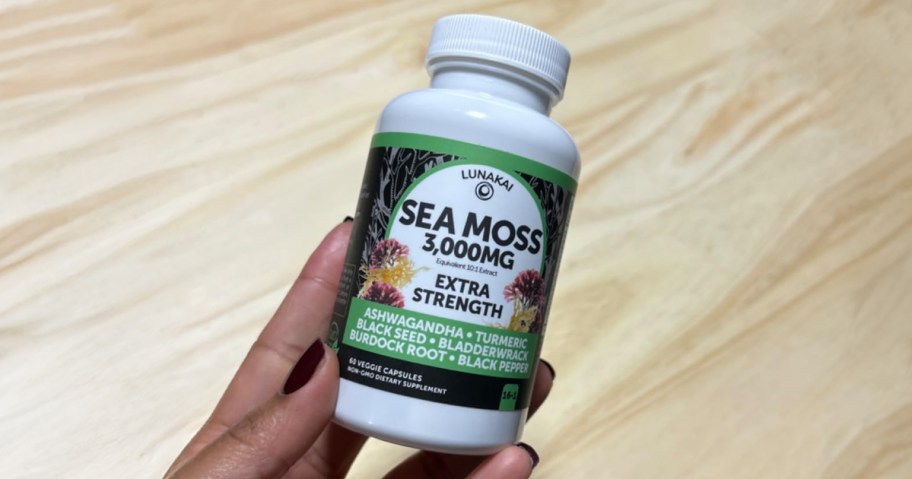 hand holding a bottle of lunakai sea moss