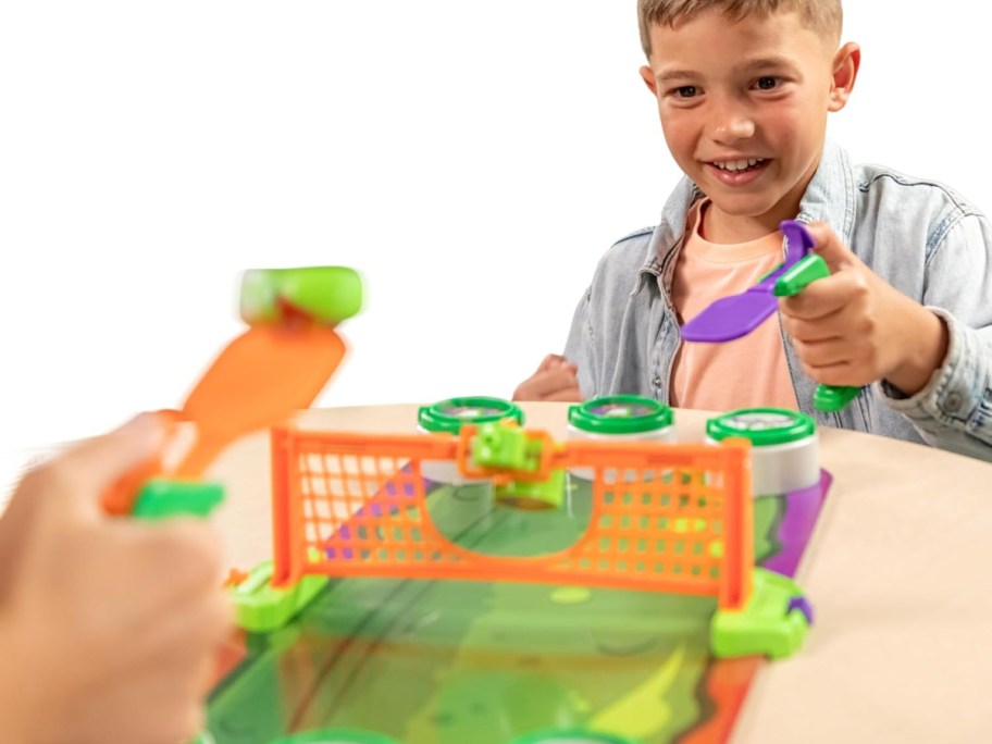 front view of boy playing pickleball blast game