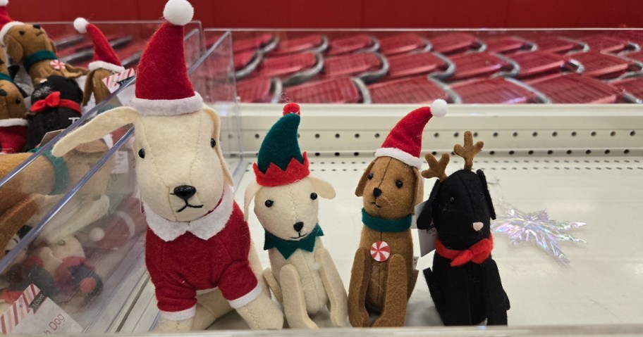 dog christmas plush large and three small on shelf in target store