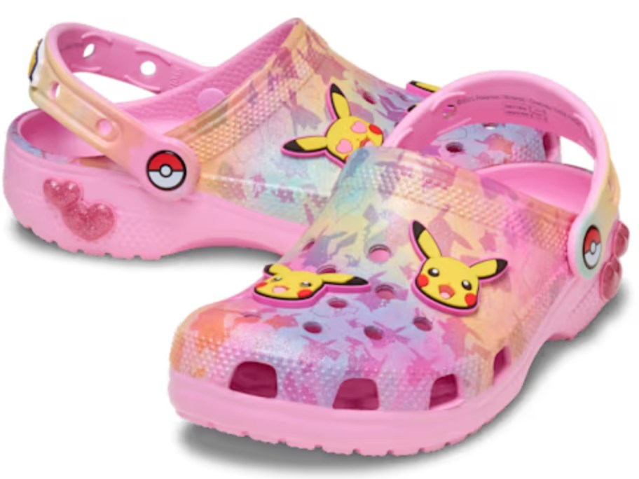 a pair of pink, purple, and yellow kids Pokemon Crocs clogs