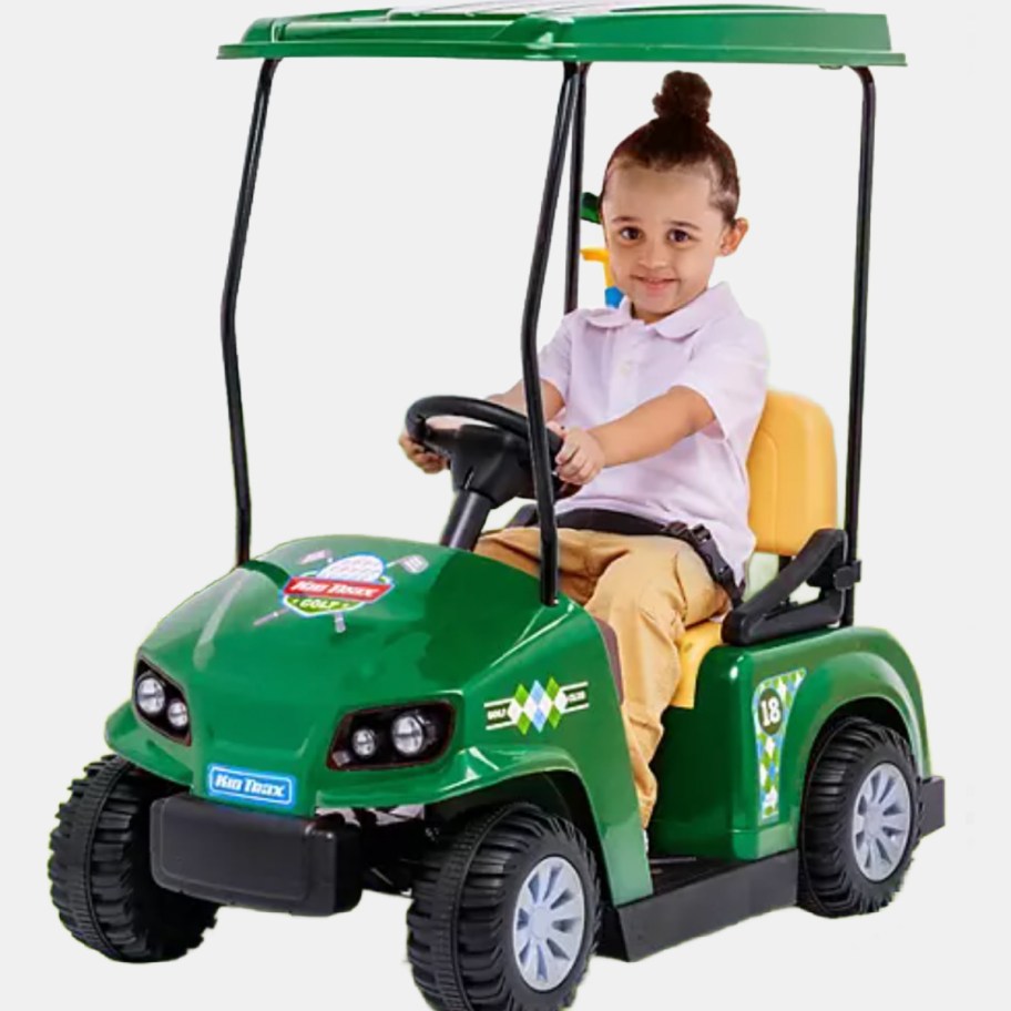 child on ride-on toy golf cart