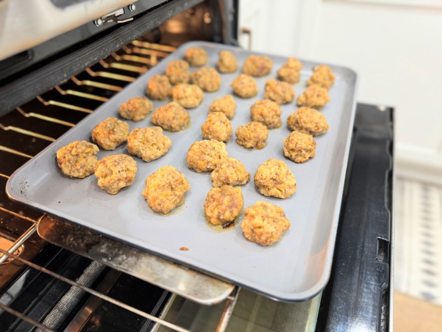 sheet pan in the oven with sausage balls