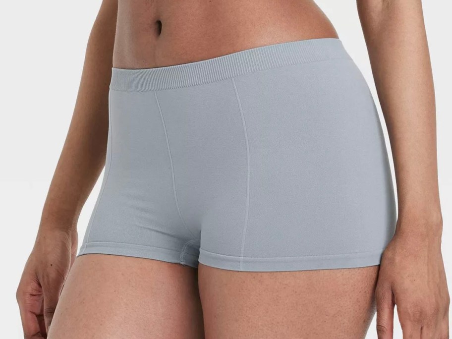 girl wearing gray boy shorts 