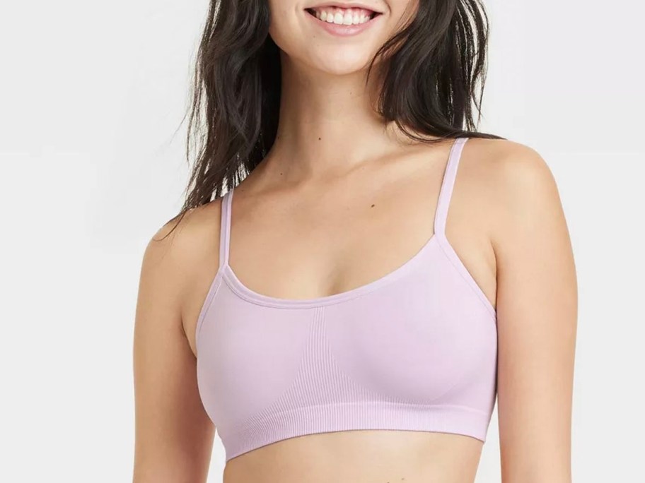 girl wearing purple bralette 