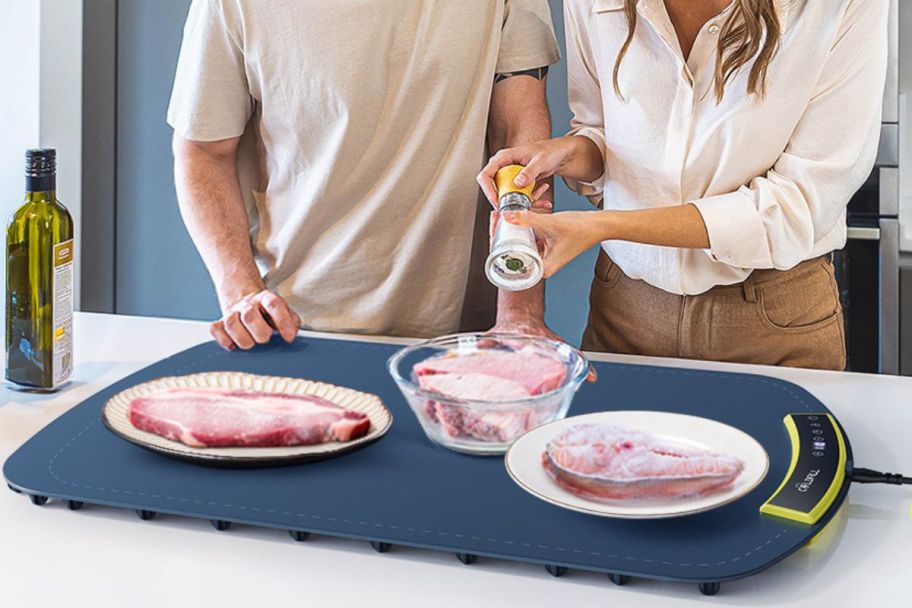 thawing mat with frozen meat on it