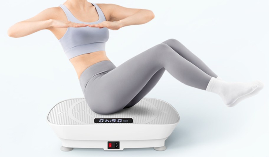 woman sitting on vibration plate