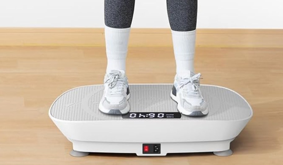 feet standing on vibration plate