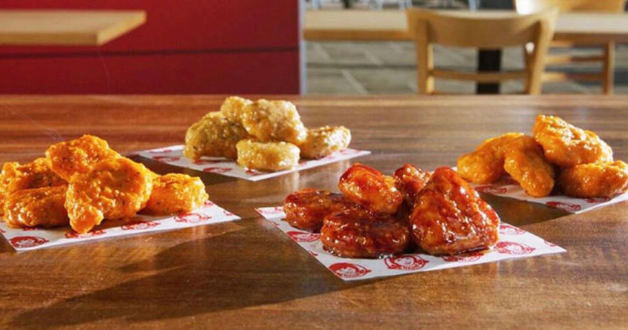 four types of saucy nuggets on table